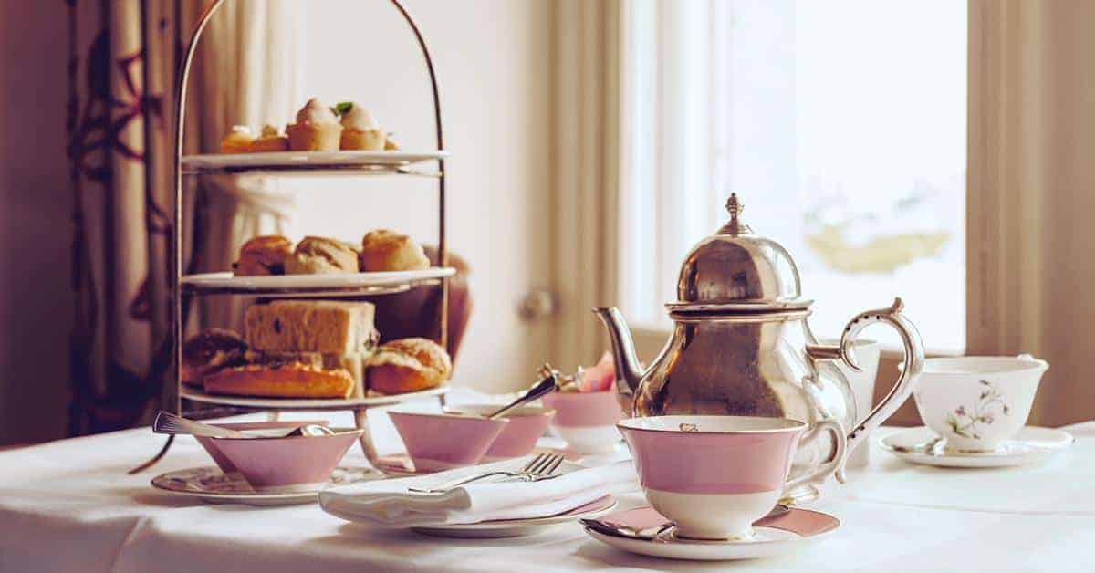 Indulge in world-class afternoon tea at The Ritz luxury hotel in London. Image credit: Eva Katalin/iStock
