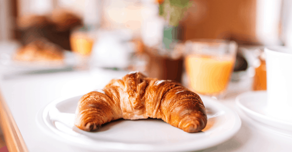 Start your morning with a buttery croissant. Image credit: Nikada/iStock