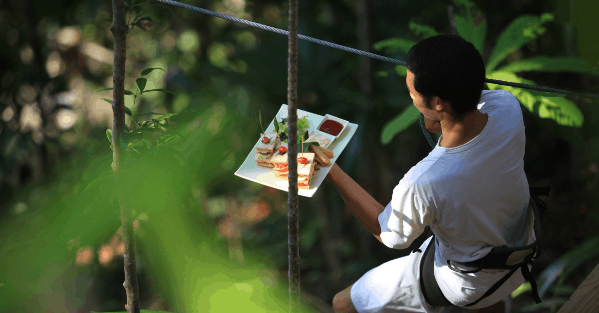 Waiters deliver your meal via zip line at this treetop restaurant location. Image credit: Soneva Kiri Resort