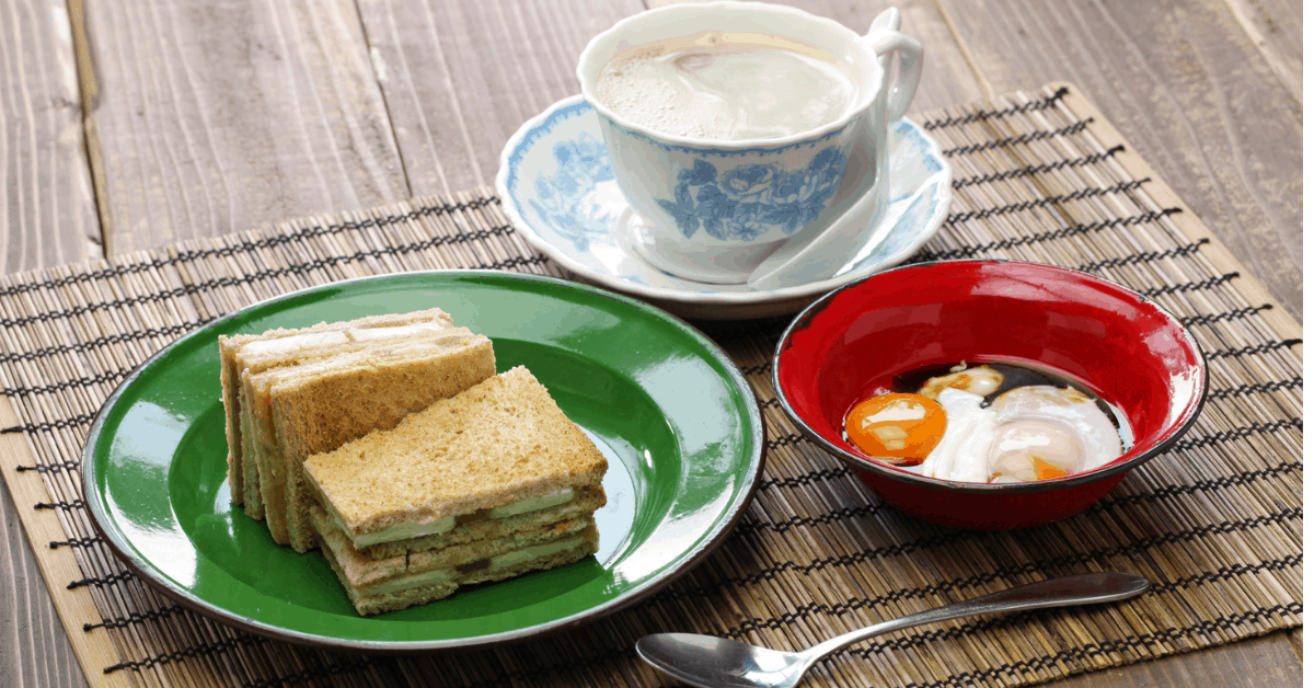 A typical Singaporean breakfast of kaya toast, soft-boiled eggs and coffee. Image credit: bonchan/iStock