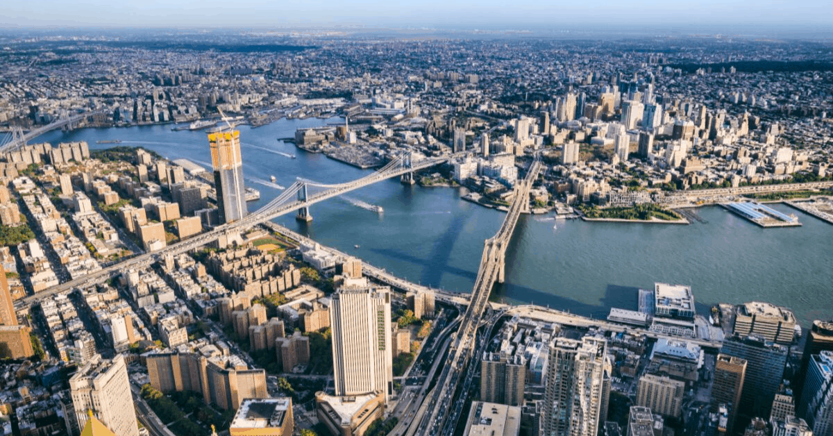 Aerial view of Brooklyn, Manhattan and Williamsburg Bridges crossing the East River. Image credit: Eloi_Omella/iStock