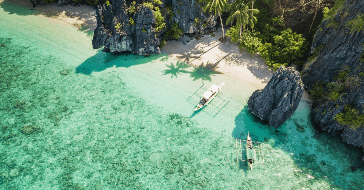 Using your miles or points could help lessen the financial blow of a last-minute getaway. Pictured: Entalula Beach, Philippines. Image credit: Mlenny/iStock