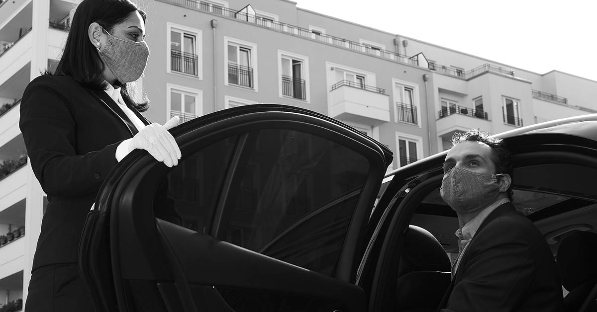 Blacklane chauffeur with guest. Image credit: Blacklane