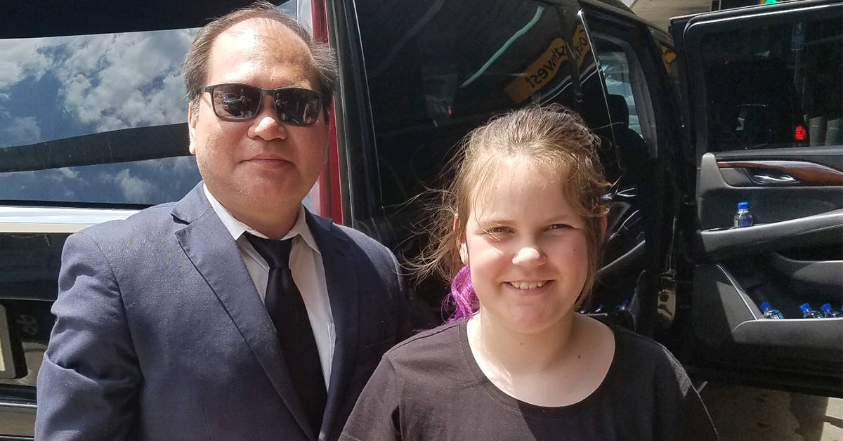 ZoeJane with a Blacklane chauffeur. Image credit: Supplied
