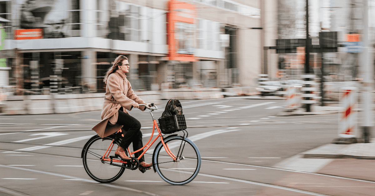 A picture of a woman on a bike