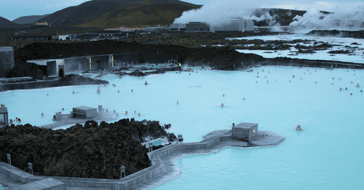 a group of people in a blue lagoon.