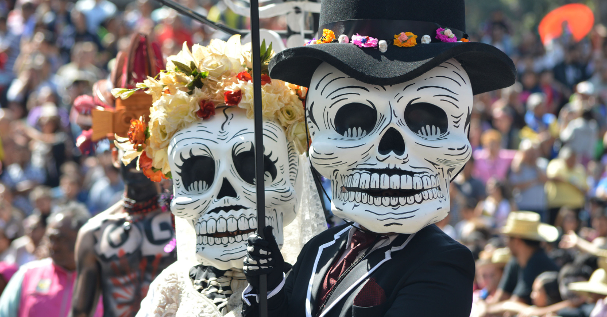 a couple of people wearing skeleton masks