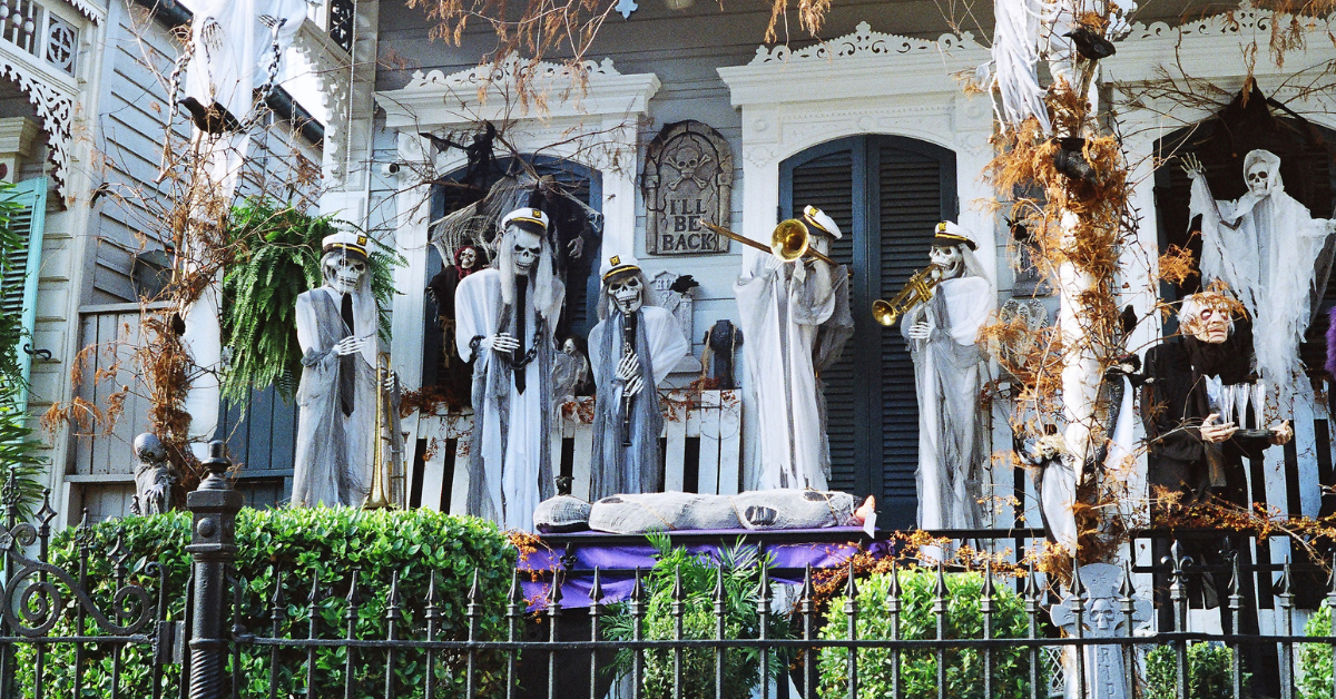 a group of skeletons playing instruments on a house
