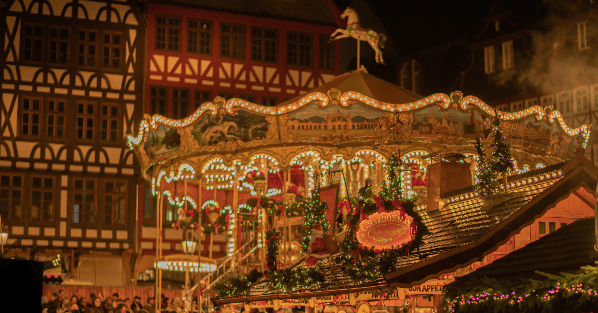 a carousel with lights and horses